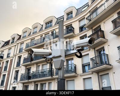 Clamart, France – December 31, 2025: Surveillance camera installed in front of a residential building, illustrating urban security measures in a subur Stock Photo