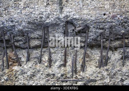 Textured surface of gray concrete wall with scratches and cracks Stock Photo
