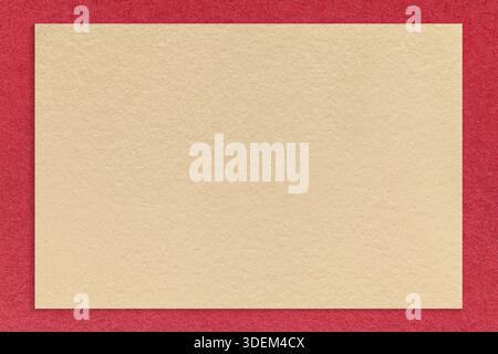 Textured light beige paper background with dark red border. Vintage kraft cardboard with frame. Banner with copy space. Stock Photo