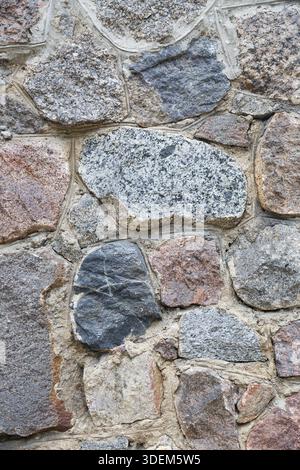 Texture of stone wall from large pieces of granite Stock Photo