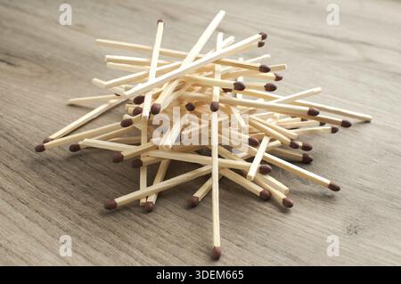 A pile of wooden safety long match sticks on wooden background Stock Photo