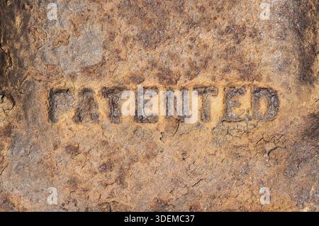 Old weathered rusty cast iron surface labeled Stock Photo