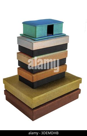 Stacked colored silk gift boxes isolated on white background Stock Photo