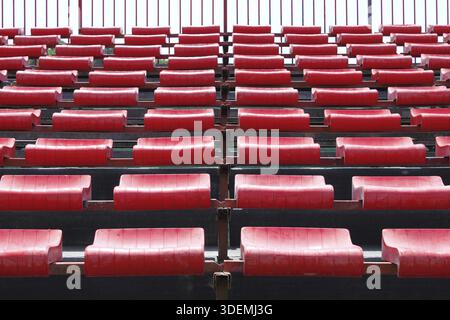 Empty and numbered seats in a stadium Stock Photo