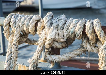 Worn out old weathered ship ropes closeup Stock Photo