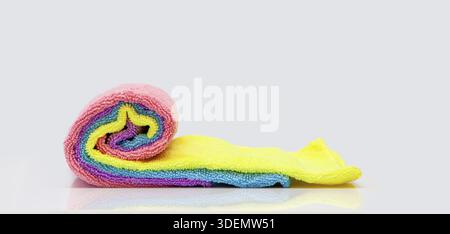 Microfiber cleaning cloth. colorful microfiber towels isolated on white background. rolled up cleaning textile cloth colorful. Domestic household clea Stock Photo