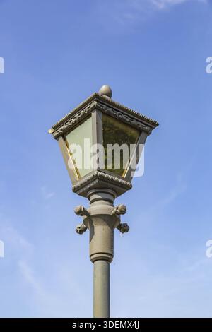 Vintage iron lantern in a public park in the daytime Stock Photo