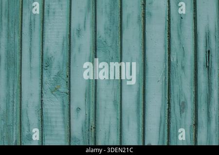 Old weathered grunge green painted wooden boards wall closeup as background Stock Photo