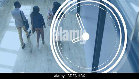 Three colleagues in blazers walking and talking in lobby, clock overlay, carrying bags, copy space Stock Photo