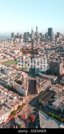 Aerial view of cityscape meeting the vast sky, the buildings casting long shadows on streets below, a dance of light and shadow, San Francisco, Califo Stock Photo
