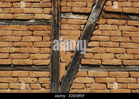 Old frame-build half-timbered red bricks barn's wall horizontal Stock Photo