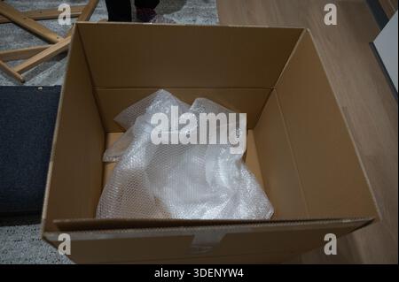 Structured setting illustrating meticulous handling of package on surface Stock Photo