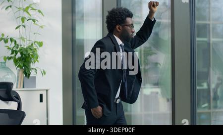 African American upset stressed business man in office thinking worried with bankruptcy bad work result looking at window businessman tired exhausted Stock Photo