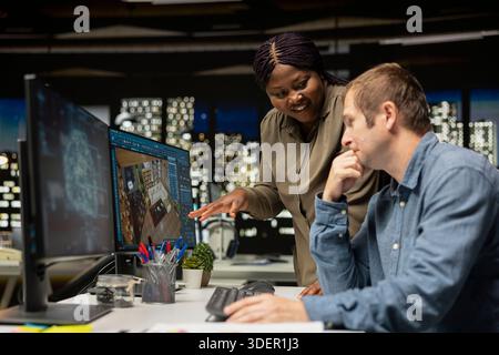Colleagues work with AI tools on 3D modeling program for a rendered apartment, architectural designers team using CAD software for floor plan and layout. Neural networks system. Stock Photo