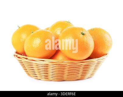 Wicker basket full of fresh ripe oranges isolated on white background. High quality photo Stock Photo
