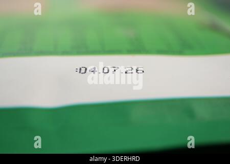 Date printed on a green package label for food product Stock Photo
