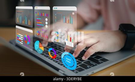 Close up of woman hands using laptop with virtual dashboard, financial graph, data analytics and business strategy. Professional working on big data s Stock Photo