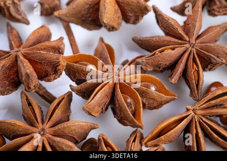Flat arrangement of star anise, Star anise spread on surface for food photography, Flatlay of star anise used in culinary styling and photography Stock Photo