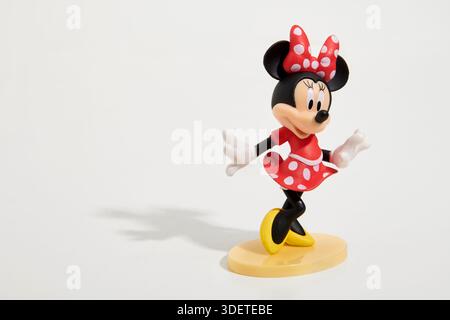 Cute toy figure of famous cartoon character Minnie Mouse on white background Stock Photo
