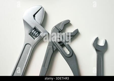 Set of professional plumbing and mechanical hand tools isolated on white background Stock Photo