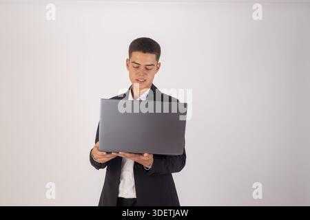 Businessman using laptop computer in suit Stock Photo
