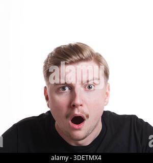 Shocking news. Wonder man expressing amaze on face Stock Photo