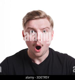 Shocking news. Wonder man expressing amaze on face Stock Photo