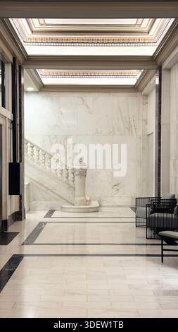Grand lobby area with a white elegant marble staircase Stock Photo