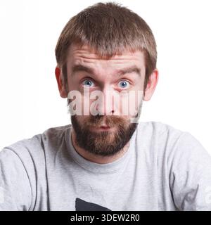 Shocking news. Wonder man expressing amaze on face Stock Photo