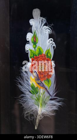 Hand Painted Exotic Bird and Cherry Blossom on Real Bird Feather Artwork Stock Photo