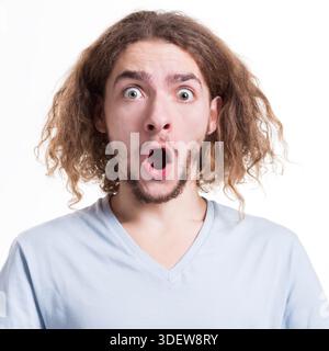 Shocking news. Wonder man expressing amaze on face Stock Photo