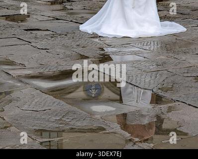 Florence, Italy, marriage, bride and groom reflected in puddle, wet, bride wedding dress, loving couple, Stock Photo