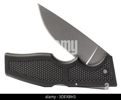 Sharp blade just starting to come out of a folding EDC knife with a textured black handle isolated on a white background. Stock Photo