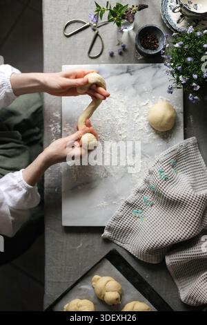 Sour dough making process. Hands in frame. Stock Photo