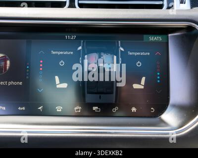 A modern car infotainment screen displays heated and ventilated seat controls, highlighting advanced comfort features, climate customization, and user Stock Photo