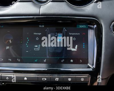 A modern car infotainment screen displays heated and ventilated seat controls, highlighting advanced comfort features, climate customization, and user Stock Photo
