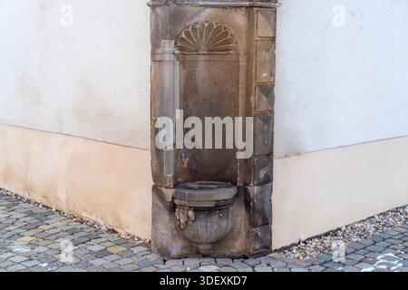 Texture of an Old Building Corner with Damaged Downspout and Damp Stains. Stock Photo
