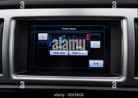 A modern car infotainment screen displays heated and ventilated seat controls, highlighting advanced comfort features, climate customization, and user Stock Photo