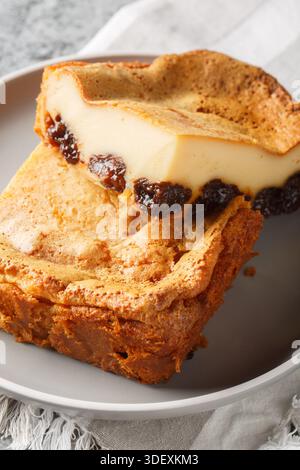 Far Breton is a delicious French dessert baked, creating a thick custardy texture that is enhanced with the flavor of dried prunes and rum closeup on Stock Photo