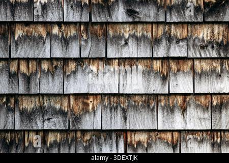 Close-up of weathered wooden shingle siding on an abandoned house at Val-Jalbert Historical Village Stock Photo