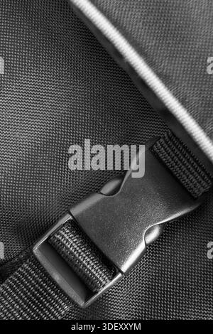 Black waterproof fabric bag fastex clasp lock closeup Stock Photo
