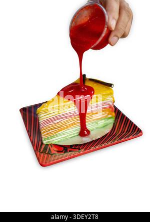 Die cut of rainbow crepe cake on white isolated. Stock Photo