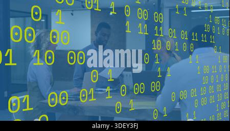 Presenting man in business-casual leading team at open-plan table, with laptop and binary overlay Stock Photo