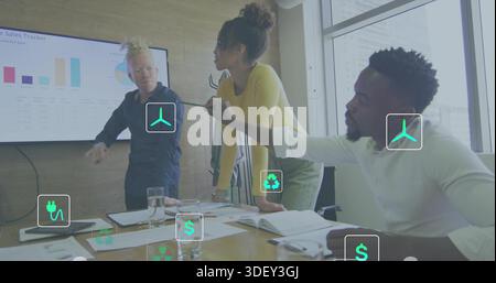 Collaborating three colleagues wearing dark, yellow, white shirts pointing in meeting room, display Stock Photo