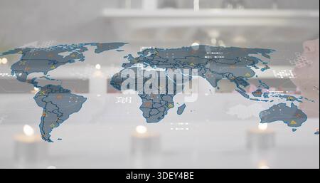 Displaying translucent world map overlay covering most of frame on glass desk, with warning icons Stock Photo