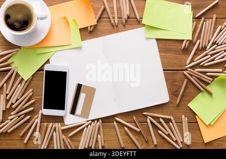 Creative Workspace With Coffee, Notebook, and Colored Notes for Brainstorming Ideas Stock Photo
