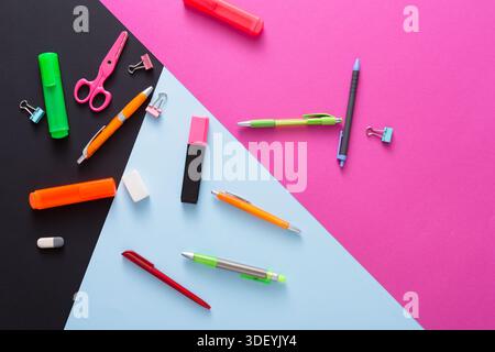 Colorful Stationery Items Arranged on a Vibrant Background in a Creative Workspace Stock Photo