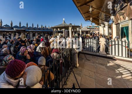 A crowd gathers in front of the Mevlana Museum (Turkish: Mevlânâ Müzesi). It is the mausoleum of Jalāl ad-Dīn ar-Rūmī with the adjoining lodge of the Mevlevi dervish brotherhood. Karatay, Konya, Central Anatolia Region, Turkey Stock Photo