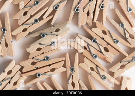 Wooden clothespins isolated on white background. Close up Stock Photo