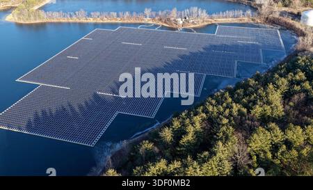 Aerial View of Floating Solar Panel Array on Freshwater Reservoir in New Jersey Stock Photo